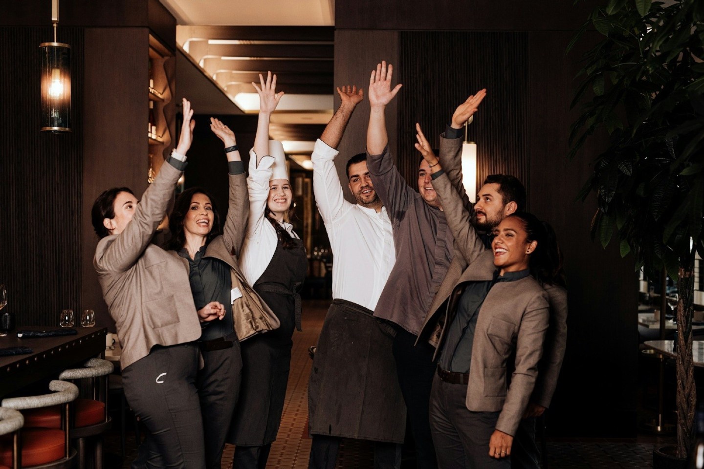 Photo of Hilton employees high-fiving