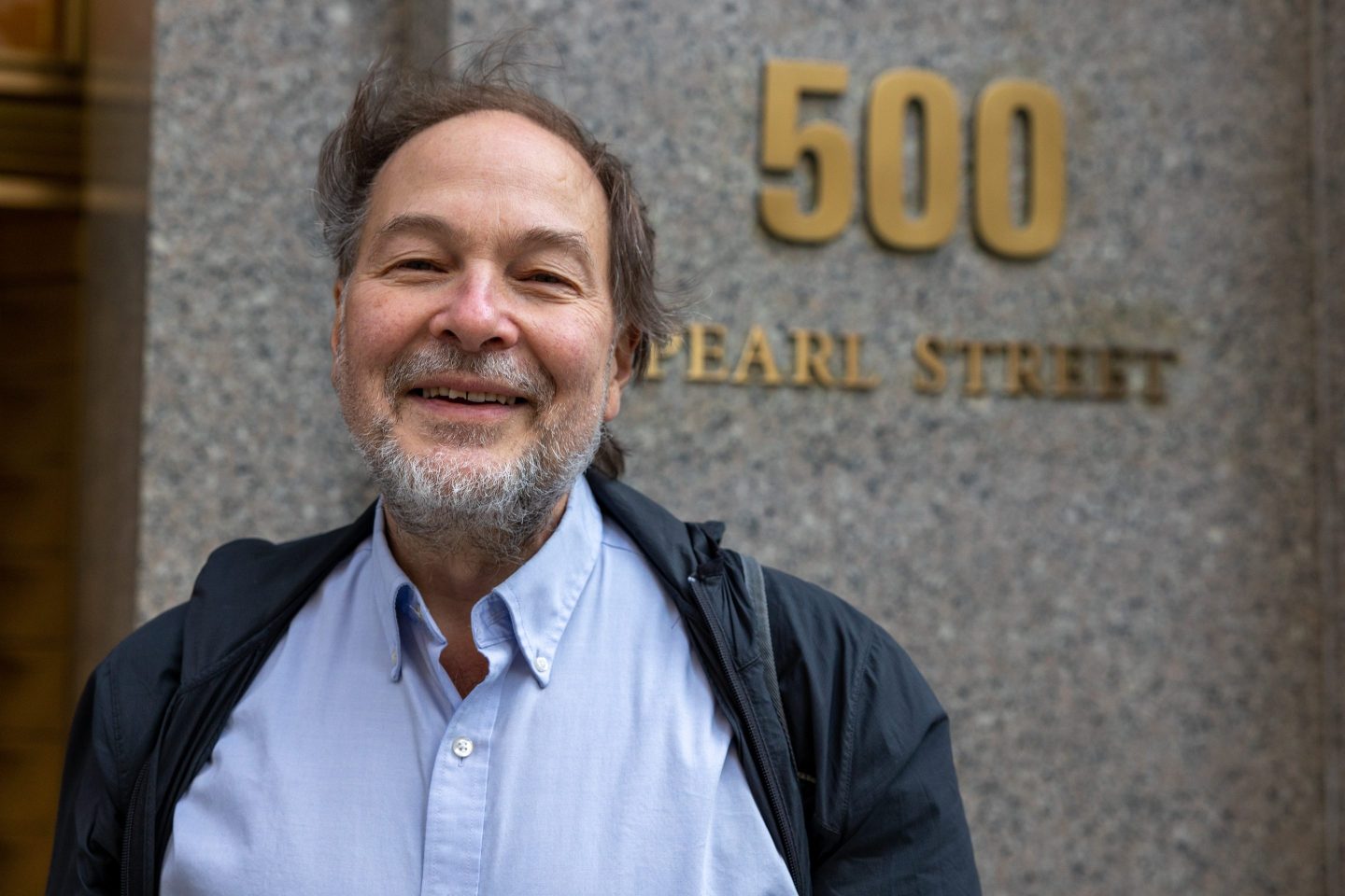 Matthew Russell Lee, the man behind Inner City Press, standing outside the SDNY courthouse.