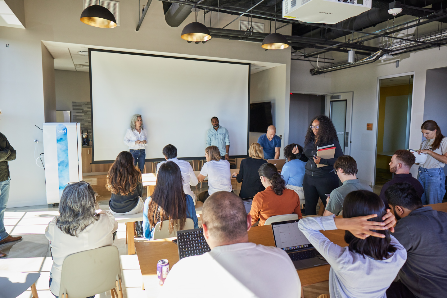 Allstate employees gather in one of the insurance giant's new offices, designed for collaborative gatherings.