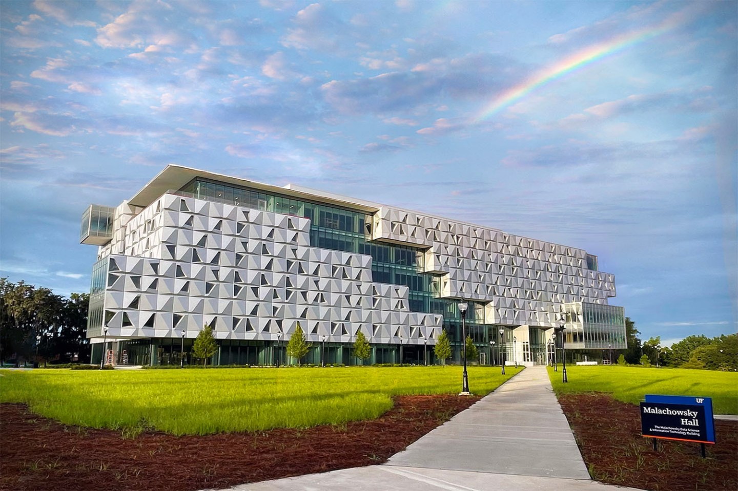 Photo of a building with blue skies and a rainbow