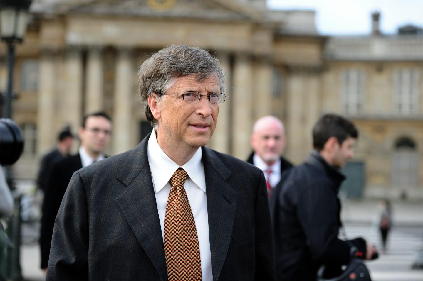 Bill Gates says his approach is still ‘glass half full’ on climate change, but he’s calling on big corporations to do some heavy lifting too