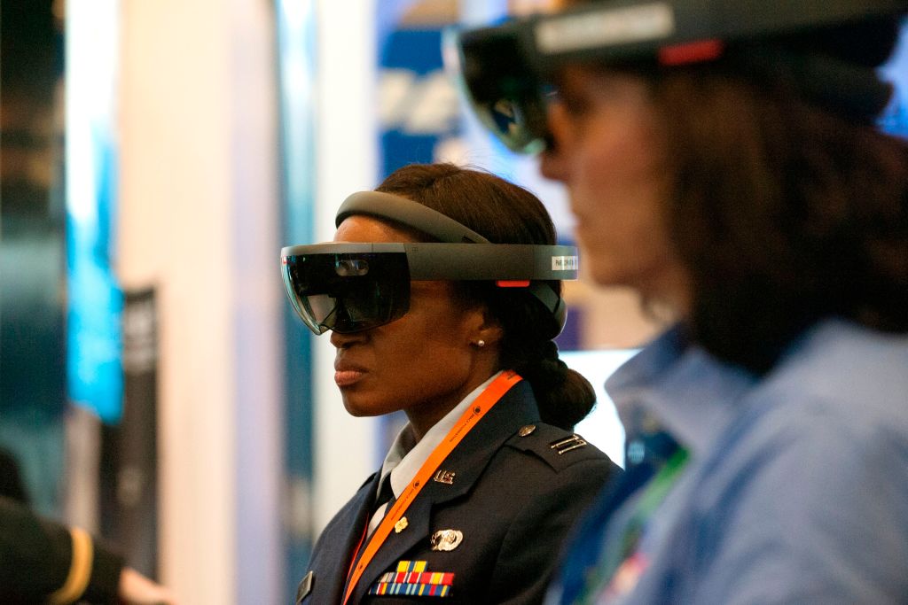 Attendees wear googles while participating in an Augmented Reality demonstration hosted by U.S. defense contractor Raytheon during the 35th Space Symposium at The Broadmoor in Colorado Springs, Colorado, as seen in April 2019. (Photo by Jason Connolly—AFP/Getty Images)