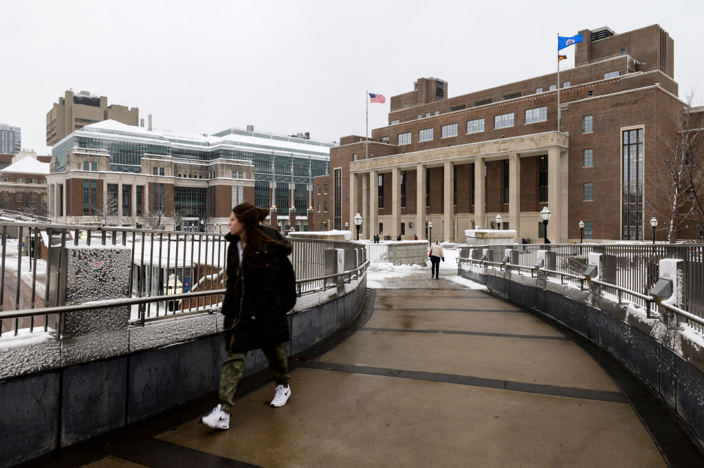 A pedestrian passes by on the University of Minnesota campus, as seen in April 2019 in Minneapolis, Minnesota. (Photo by Stephen Maturen/Getty Images)