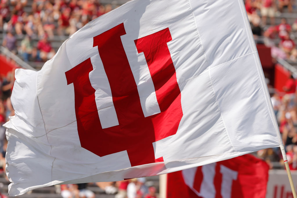 An Indiana University flag is waved during the game between the Connecticut Huskies and the Indiana Hoosiers, as seen in September 2019 at Memorial Stadium in Bloomington, IN. (Photo by Jeffrey Brown—Icon Sportswire/Getty Images)