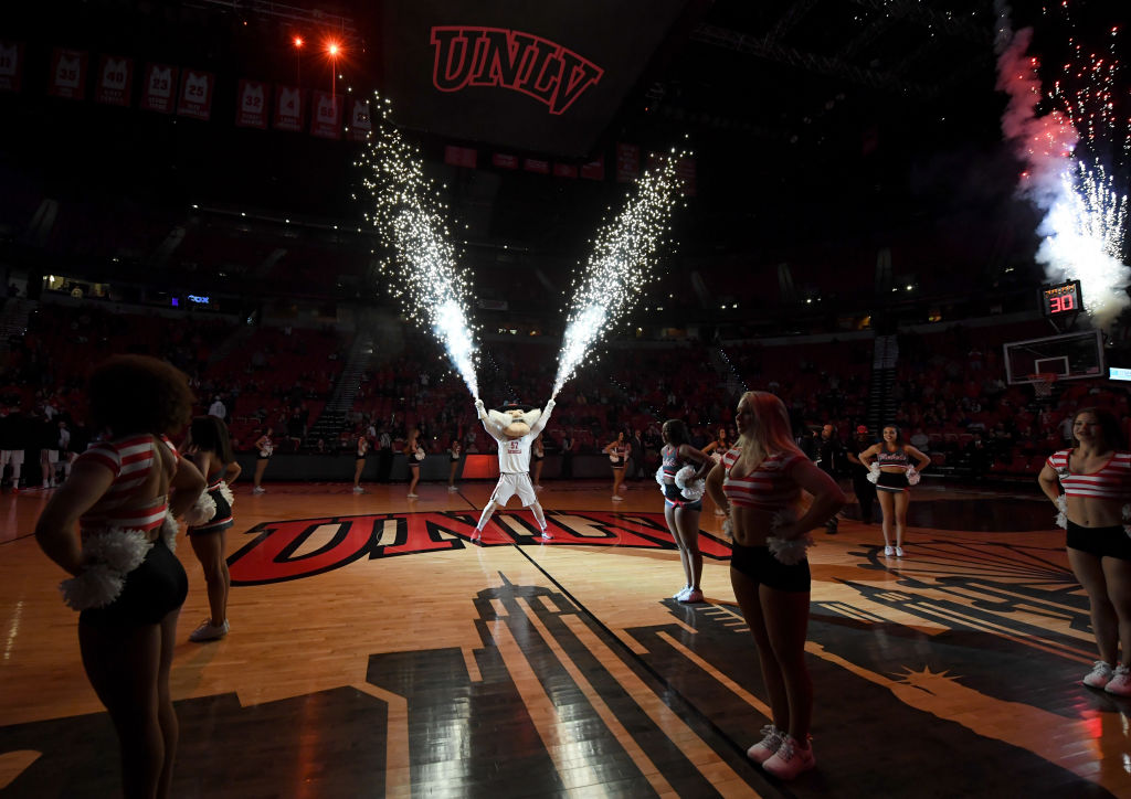 Pyrotechnics shoot from the hands of UNLV Rebels mascot Hey Reb before the team's game against the Texas State Bobcats, as seen in November 2019 in Las Vegas. (Photo by Ethan Miller/Getty Images)