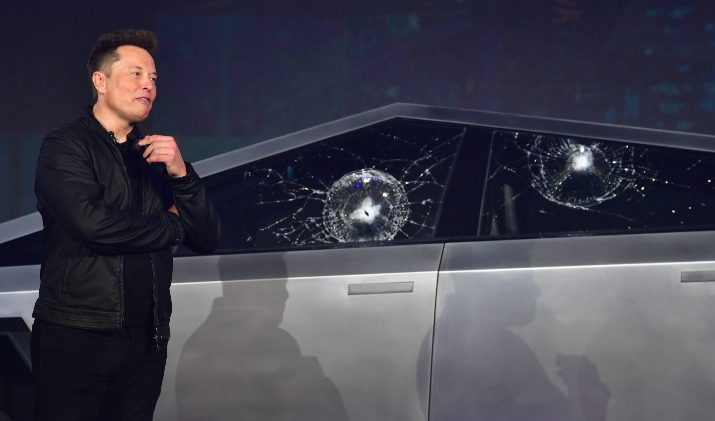 Tesla CEO Elon Musk next to the Cybertruck concept.