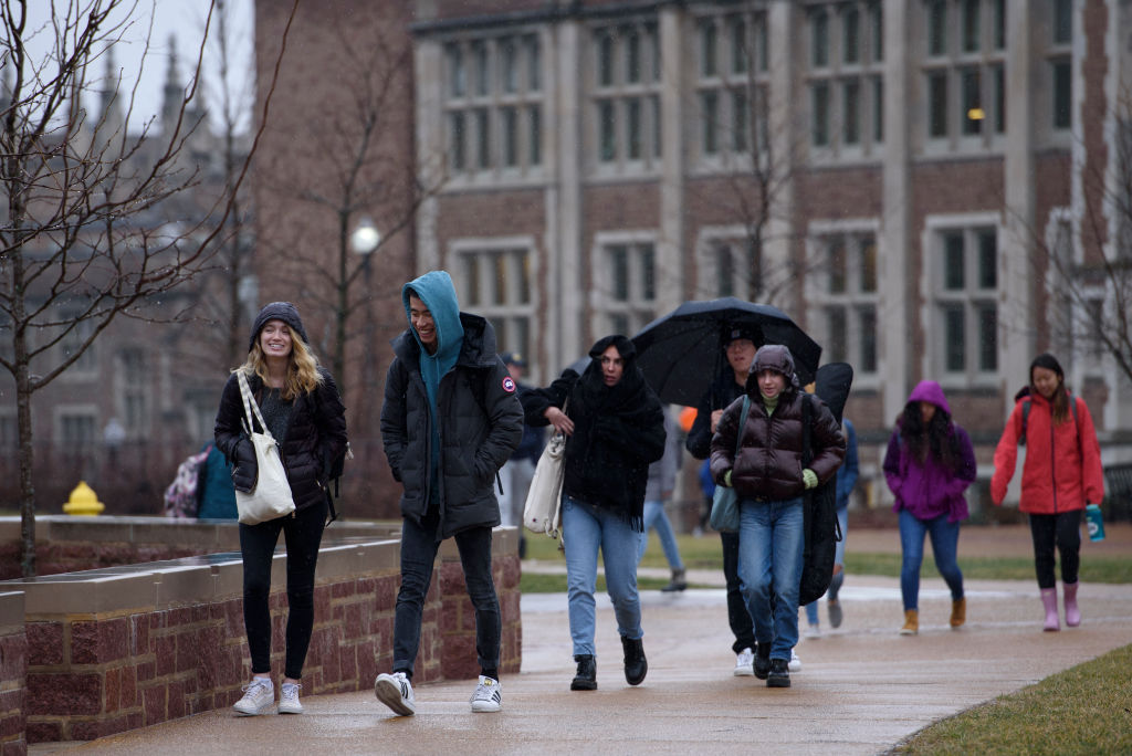 Students walk through campus at Washington University in St. Louis, as seen in February 2020. (Photo by Nick Schnelle—The Washington Post/Getty Images)