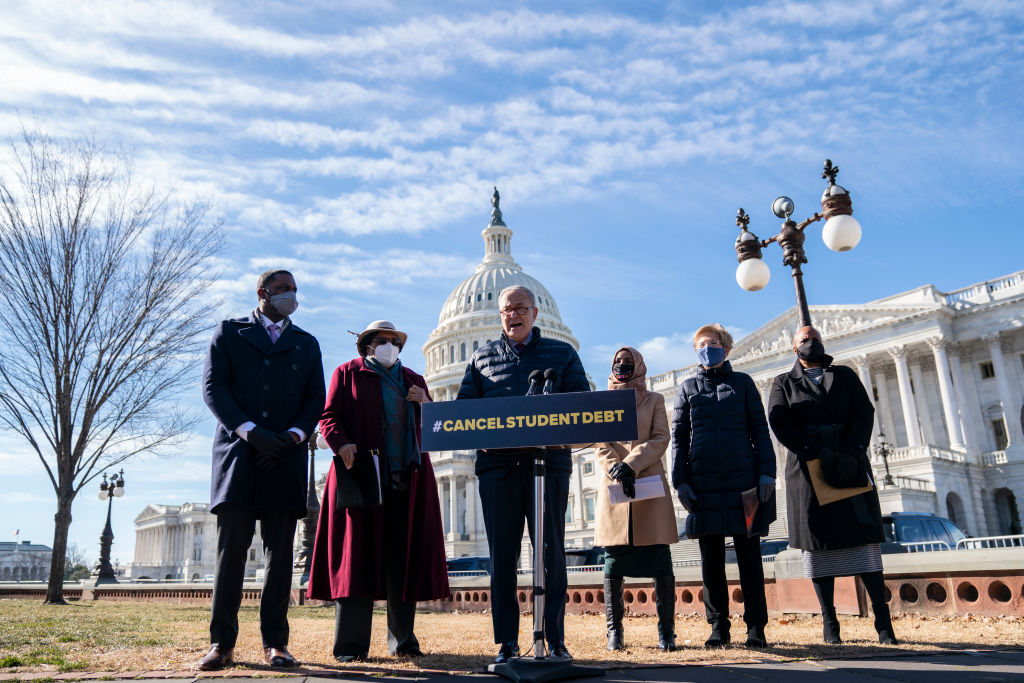 Senate Majority Leader Chuck Schumer (D-NY) speaks during a press conference about student debt outside the U.S. Capitol on February 4, 2021 in Washington, DC. Also pictured, L-R, Rep. Mondaire Jones (D-NY), Rep. Alma Adams (D-NC), Rep. Ilhan Omar (D-MN), Sen. Elizabeth Warren (D-MA) and Rep. Ayanna Pressley (D-MA). (Photo by Drew Angerer—Getty Images)
