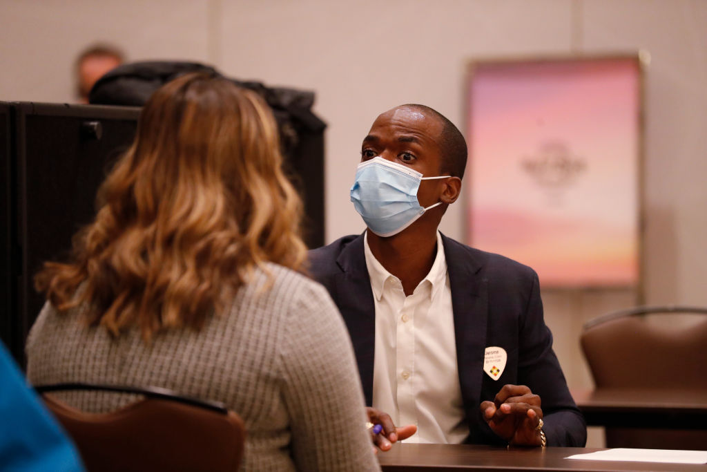 A Seminole Hard Rock Casino department manager (R) conducts an interview with a potential employee during a job fair at the Seminole Hard Rock Casino, as seen in May 2021. (Photo by Octavio Jones—Getty Images)
