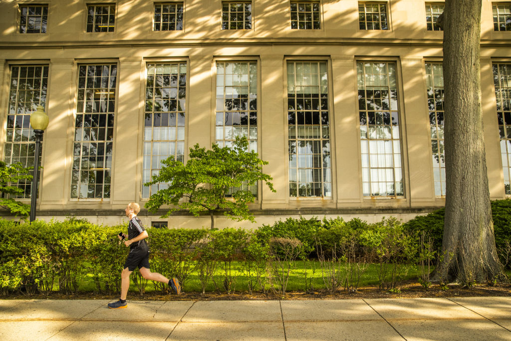 A person jogs at the Massachusetts Institute of Technology (MIT) campus in Cambridge, Massachusetts, as seen in June 2021. Adam Glanzman—Bloomberg/Getty Images