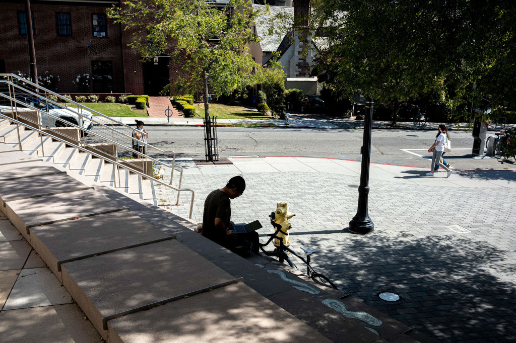 A person works on a laptop computer on the University of California, Berkeley campus in Berkeley, California, as seen in June 2021. (Photographer: David Paul Morris—Bloomberg/Getty Images)