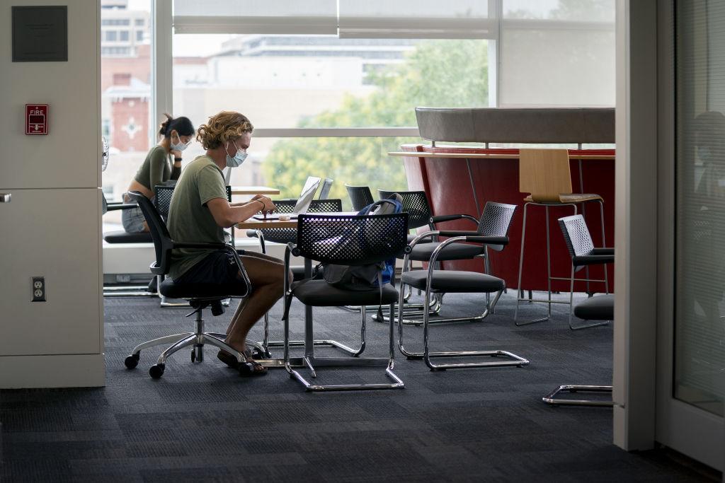 Students work on campus at the George Washington University School of Business in Washington, D.C., U.S., as seen in September 2021. (Photographer: Stefani Reynolds—Bloomberg/Getty Images)