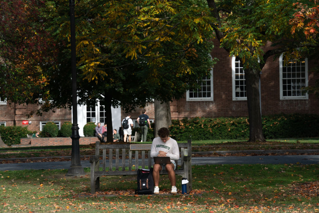 A student uses their laptop computer on the campus of Dartmouth College in Hanover, New Hampshire, U.S., as seen in October 2021. (Photographer: Bing Guan—Bloomberg/Getty Images)