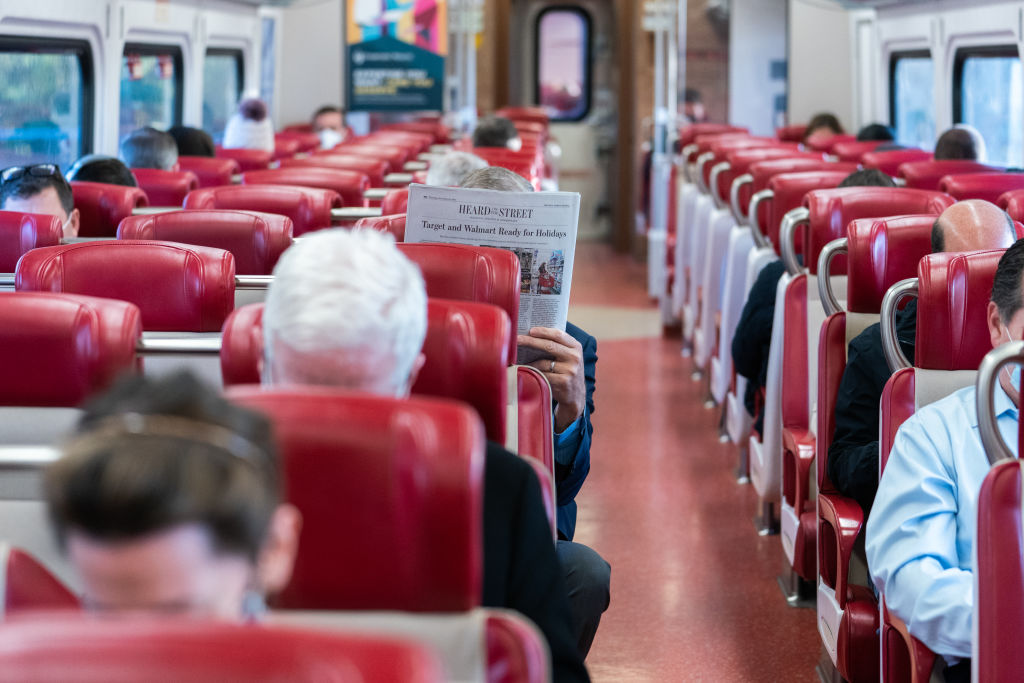 Commuters on a Metro-North train that departed from Stamford, Connecticut, U.S., as seen in November 2021. (Photographer: Jeenah Moon—Bloomberg/Getty Images)