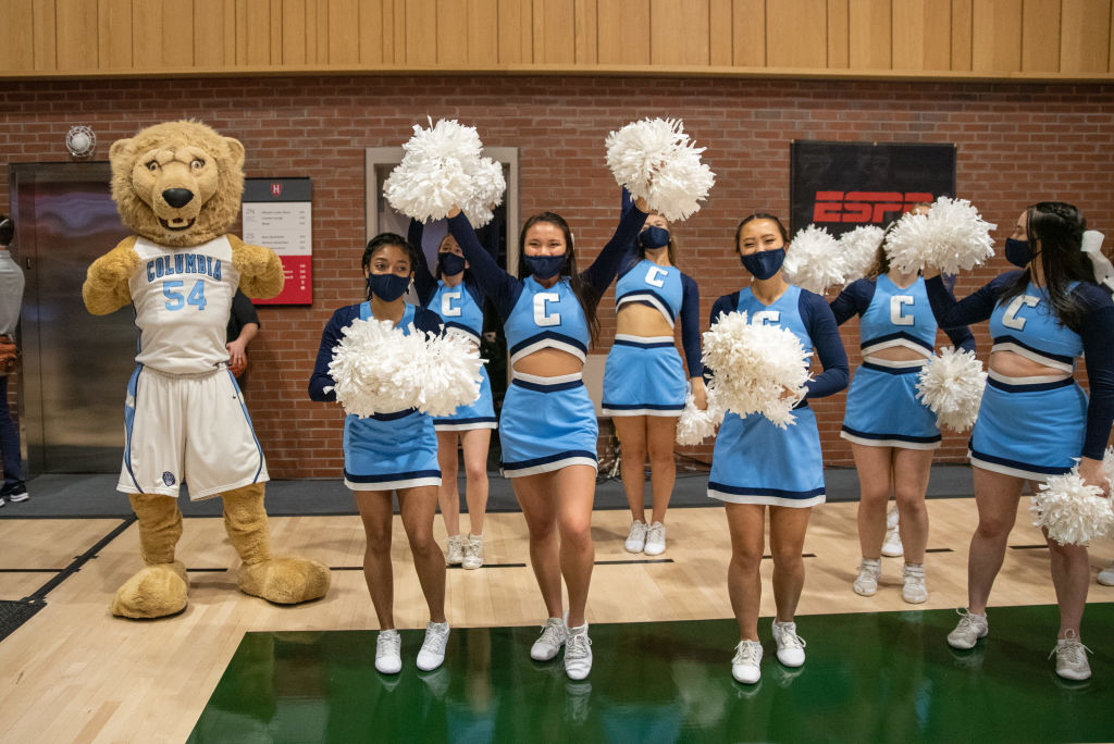 The Columbia Lions mascot Roar-ee the Lion and cheerleaders at the Ivy League Tournament between the Yale Bulldogs and Columbia Lions, as seen in March 2022. (Photo by Erica Denhoff—Icon Sportswire/Getty Images)