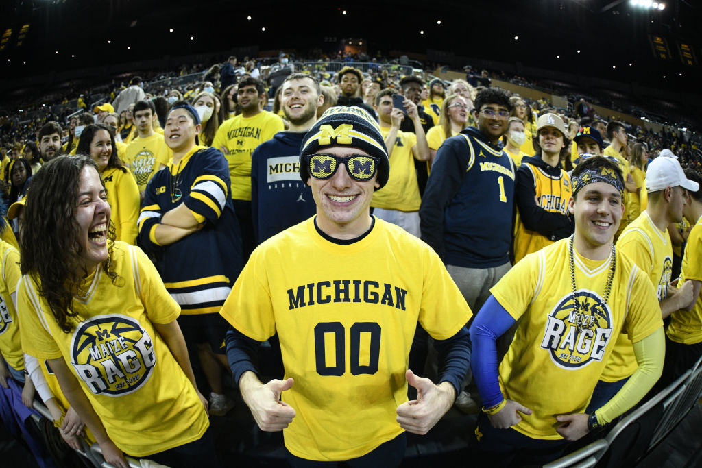 Michigan fans watch the action on the court during the first round of the 2022 NCAA Women's Basketball Tournament, as seen in March 2022 in Ann Arbor, Michigan. (Photo by Tim Fuller—NCAA Photos/Getty Images)
