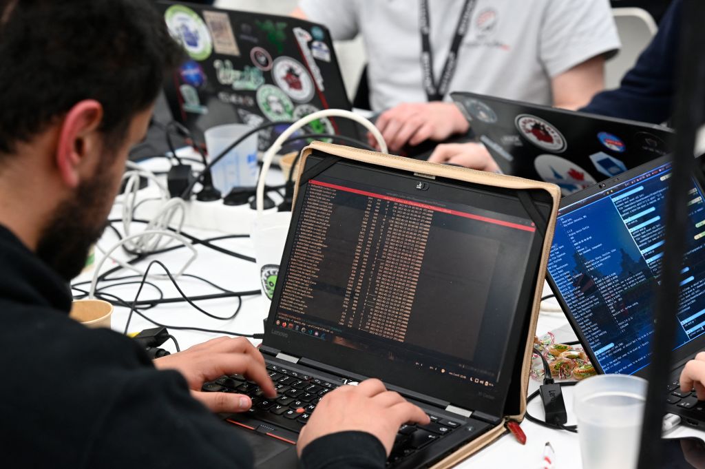 Attendees take part in a computer security competition called the "Breizh CTF" event in Rennes, western France, as seen in April 2022. (Photo by Damien MEYER—AFP/Getty Images)