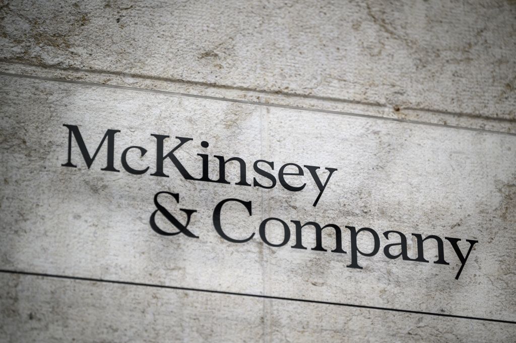 A sign of U.S.-based McKinsey & Company management consulting firm in Geneva, as seen in April 2022. (Photo by Fabrice COFFRINI—AFP/Getty Images)