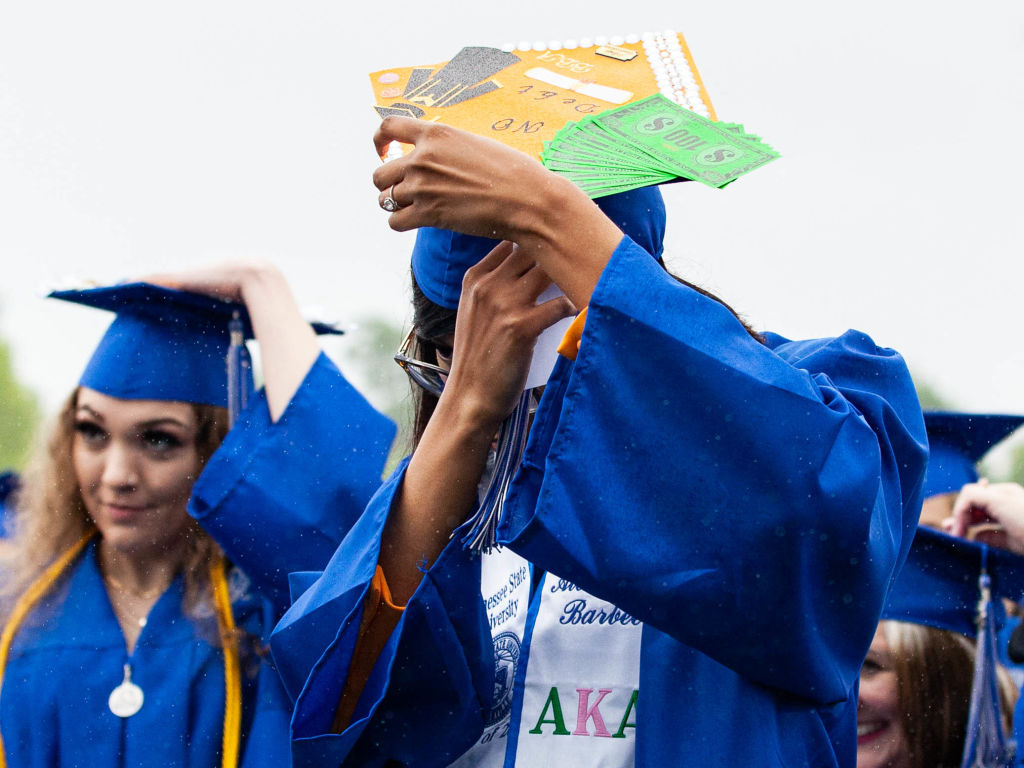 A graduating student of Tennessee State University moves their tassel to the left of their cap before graduation in Nashville, Tennessee, as seen in May 2022. (Photo by SETH HERALD—AFP/Getty Images)