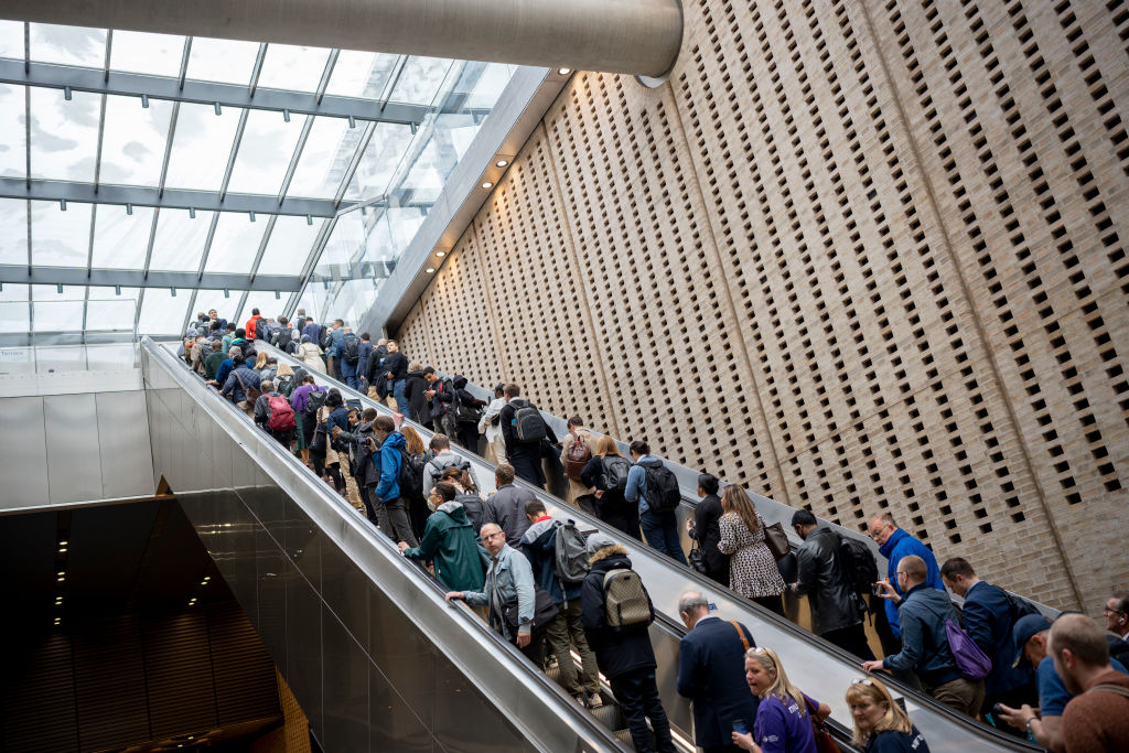 Passengers and commuters use escalators and learn how to navigate a new underground rail system on the day that the capital’s Elizabeth Line finally opens, as seen in May 2022 in London, England. (Photo by Richard Baker—In Pictures/Getty Images)