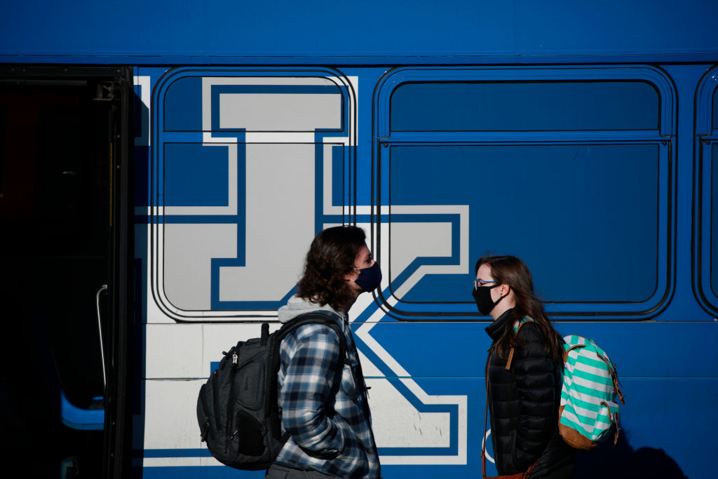 Students wear masks on the campus of the University of Kentucky in Lexington, Kentucky, as seen in January 2022. (Photo by Luke Sharrett—The Washington Post/Getty Images) OMICRONSEMESTER