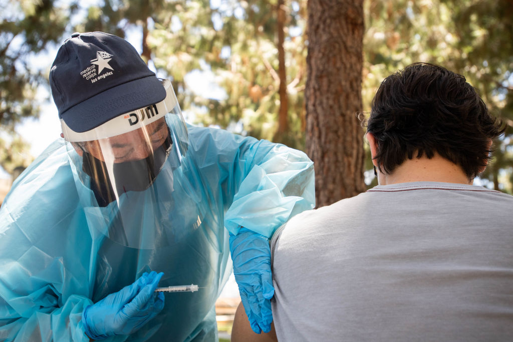 A nurse with the Medical Reserve Corps vaccinates a man for monkeypox at a Los Angeles County Department of Public Health walk-up vaccination site, in August 2022. (Photo by Sarah Reingewirtz–MediaNews Group/Los Angeles Daily News/Getty Images)