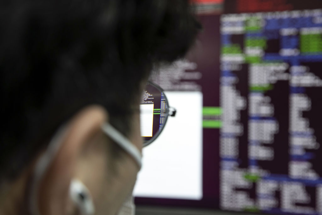 An employee at his desk at S2W Inc., a South Korean cybersecurity company, in Pangyo Techno Valley, Seoul, South Korea, as seen in August 2022. (Photographer: Woohae Cho—Bloomberg/Getty Images)