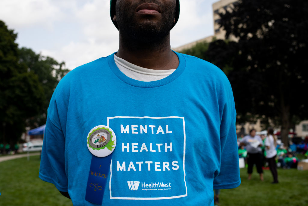 An advocate wears a shirt reading "Mental Health Matters" during a 'Walk A Mile In My Shoes' rally at the Michigan State Capitol in Lansing, Michigan, as seen in September 2022. (Photo by Emily Elconin—Bloomberg/Getty Images)