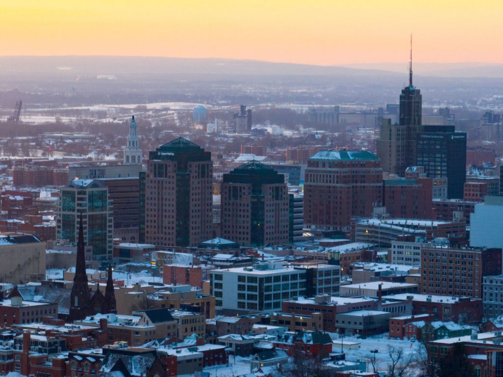 In this aerial photo, the Sun rises over Buffalo, New York, as seen in December 2022. (Photo by Joed Viera—AFP/Getty Images)