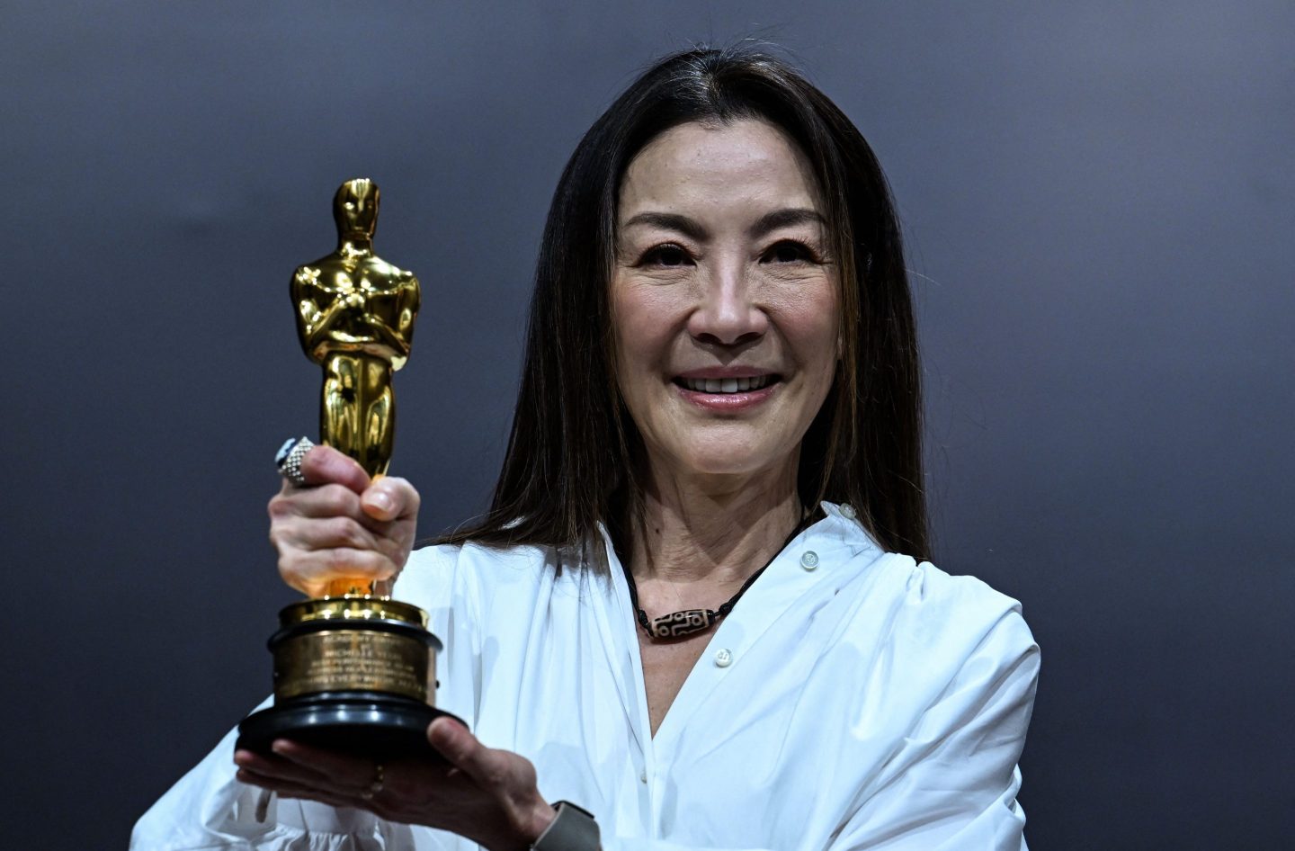 Michelle Yeoh poses with the Oscar for Best Actress in a Leading Role for "Everything Everywhere All at Once."