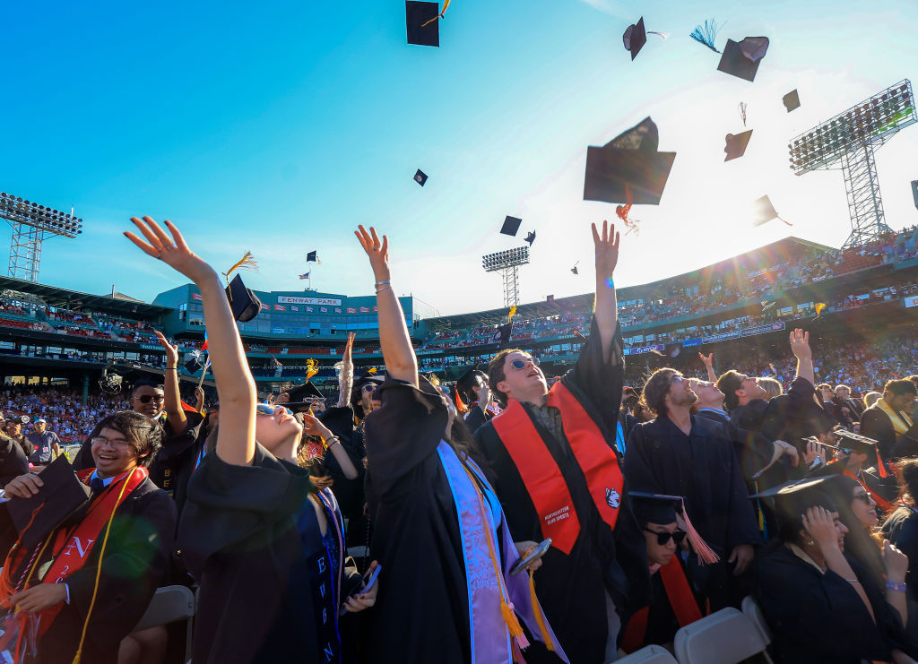 Northeastern University students celebrate the conclusion of their University's 121st undergraduate commencement at Fenway Park, as seen in May 2023. (Photo by Matthew J. Lee—The Boston Globe/Getty Images)