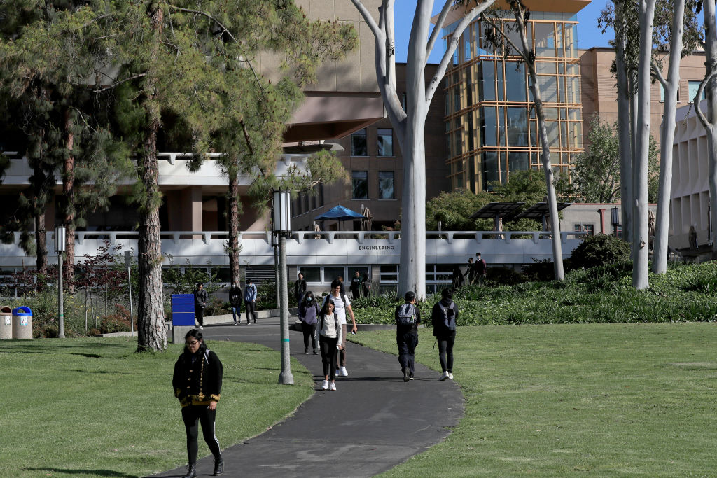 Students and faculty travel through the campus at the University of California-Irvine in Irvine, as seen in May 2023. (Photo by Allen J. Schaben—Los Angeles Times/Getty Images)