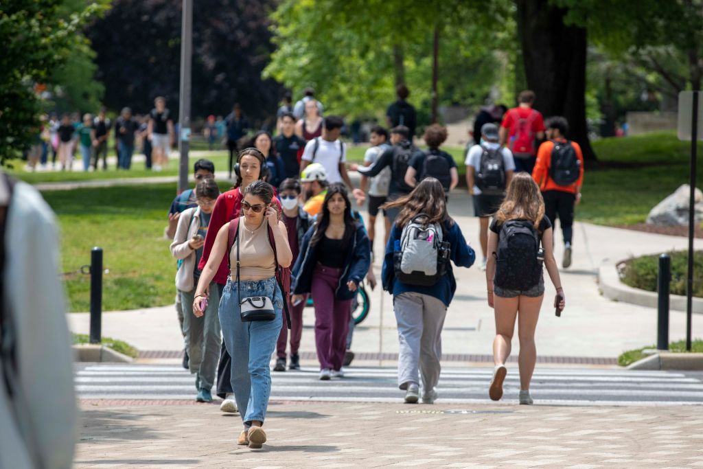 Students walk around campus at the University of Maryland in College Park, Maryland, as seen in May 2023. (Photo by Amanda Andrade-Rhoades—For The Washington Post/Getty Images)