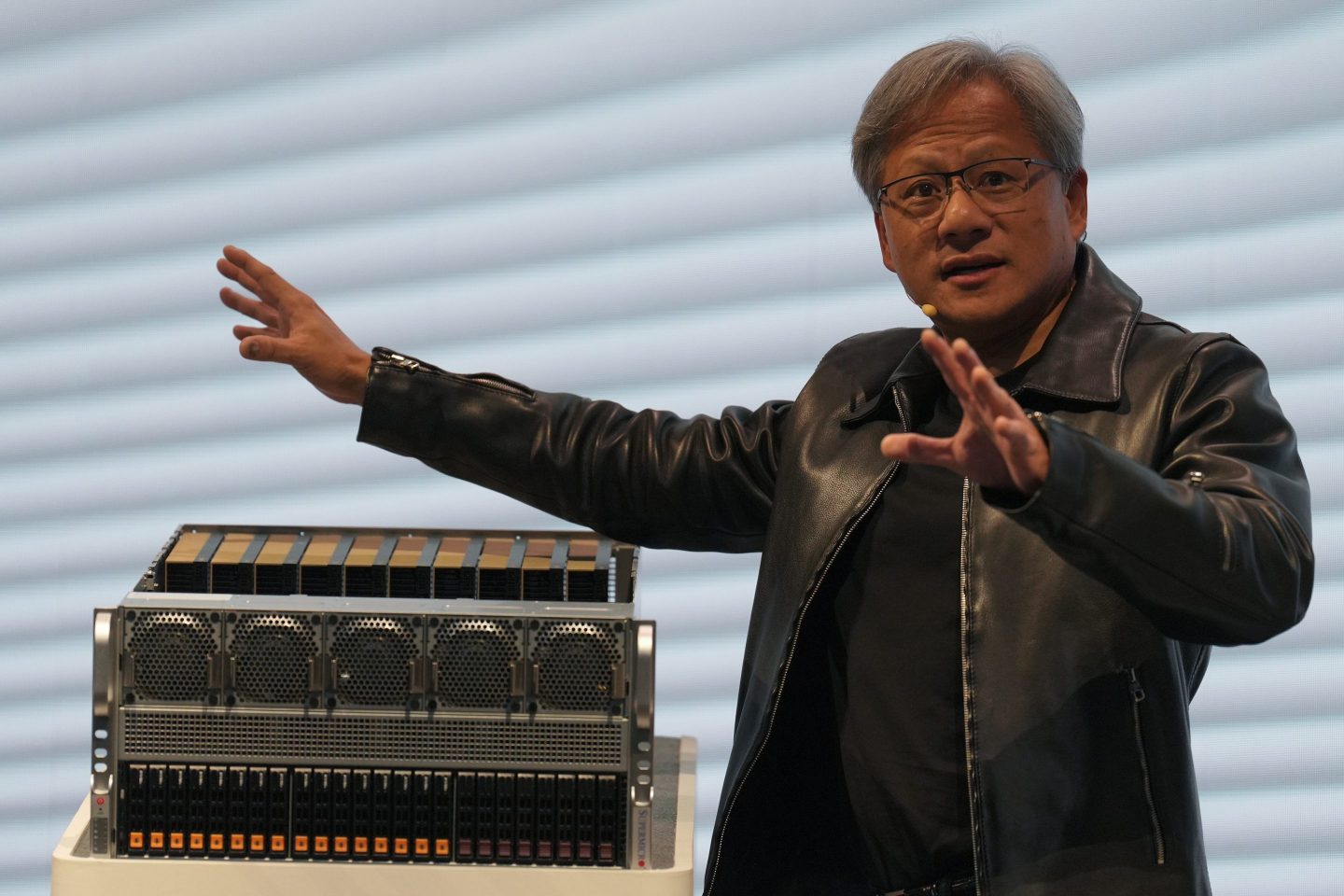 Nvidia's CEO Jensen Huang speaking at COMPUTEX 2023 in Taipei. Huang said on Tuesday that Nvidia will partner with Japanese firms to build chip plants in Japan to meet AI demand.