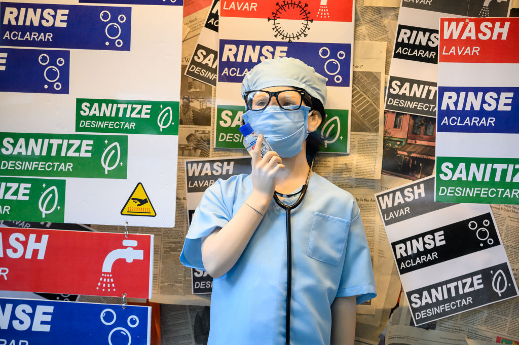 A mannequin dressed in a nurse uniform holds hand sanitizer inside a store on the Upper West Side, as seen in August 2020 in New York City. (Photo by Noam Galai/Getty Images)