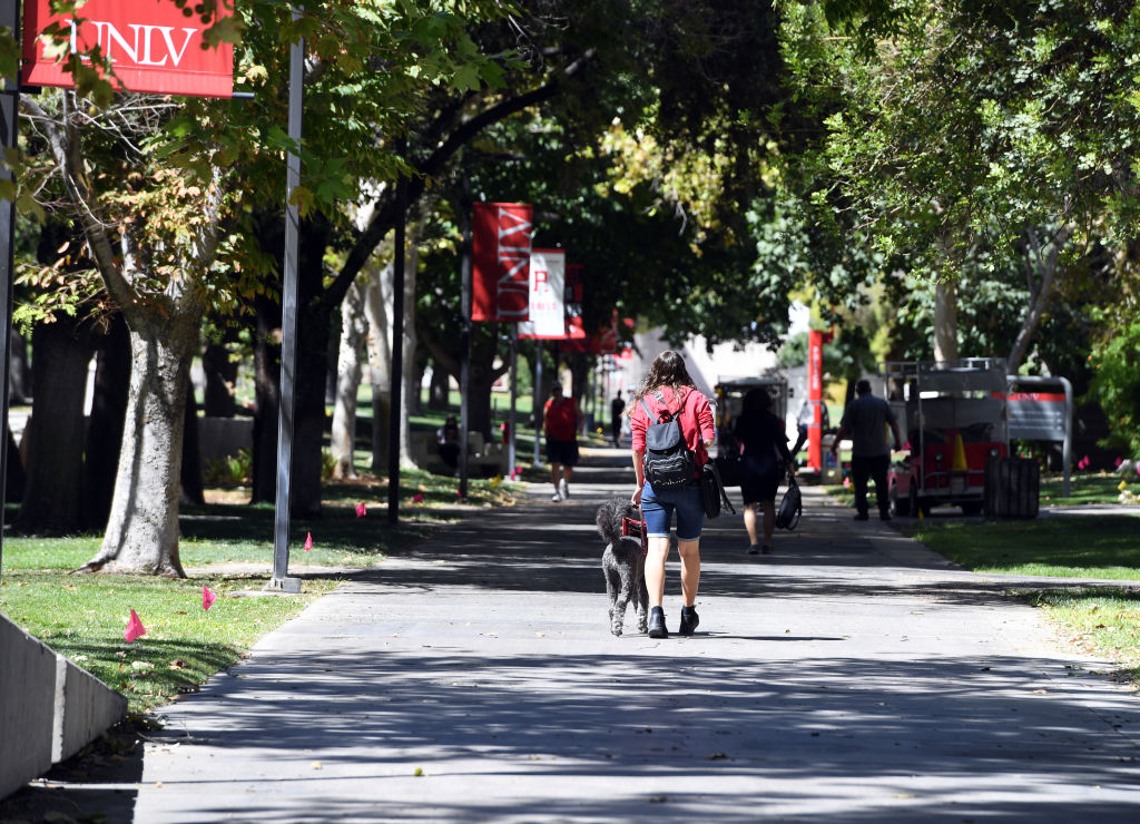 A UNLV student walks on campus after attending a class at UNLV, as seen in September 2020. (Photo by Ethan Miller/Getty Images)