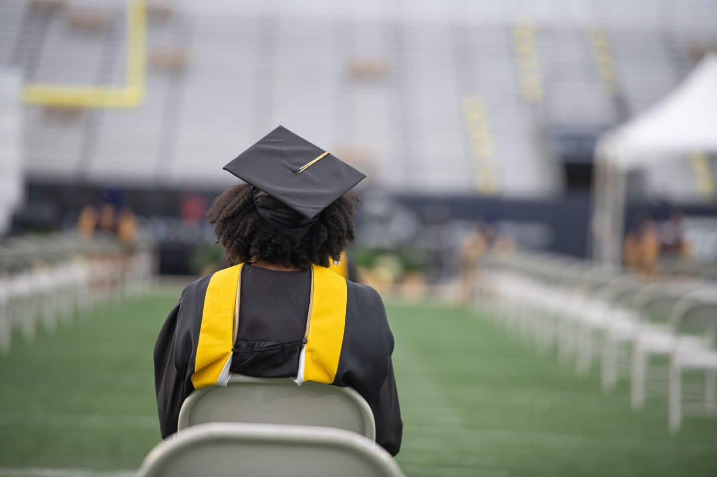 Georgia Tech graduate attends the fall commencement at Bobby Dodd Stadium on December 12, 2020 in Atlanta, Georgia. (Photo by Marcus Ingram/Getty Images)
