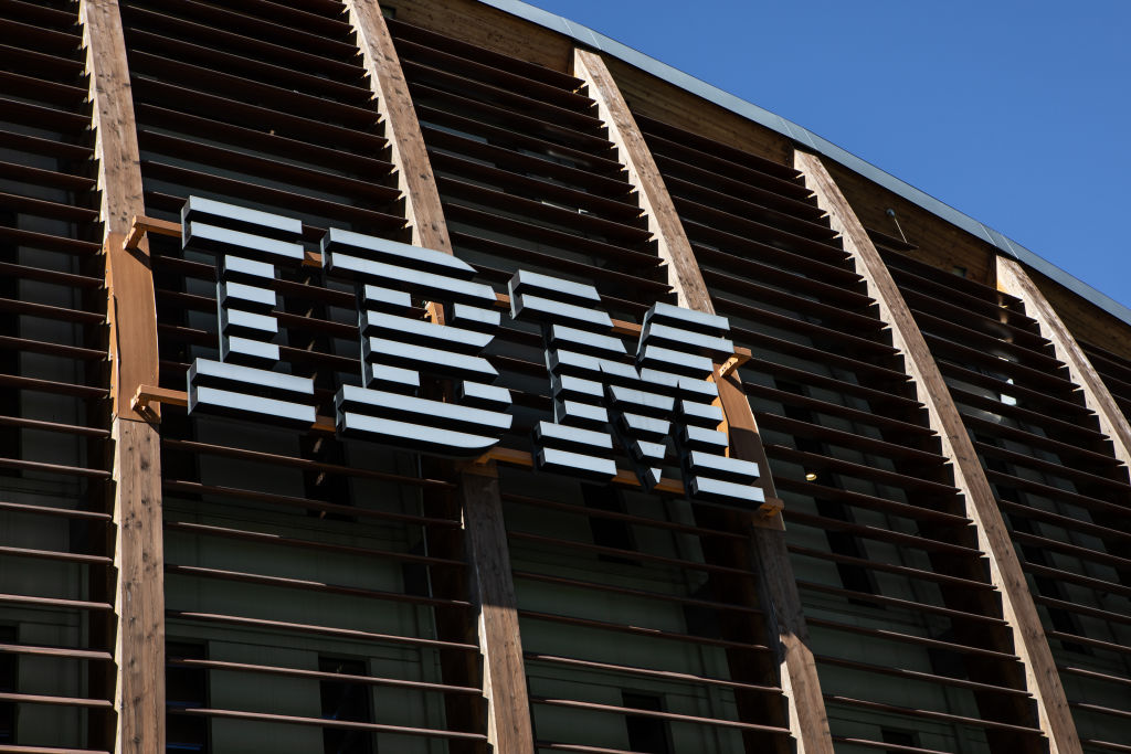 The logo of International Business Machines (IBM) stands on the facade of the local headquarters, as seen in May 2021 in Milan, Italy. (Photo by Emanuele Cremaschi/Getty Images)
