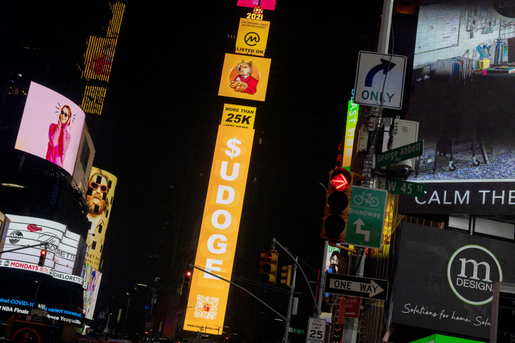 A billboard in Times Square displays signs for Dogecoin, as seen in July 2021. Alexi Rosenfeld—Getty Images