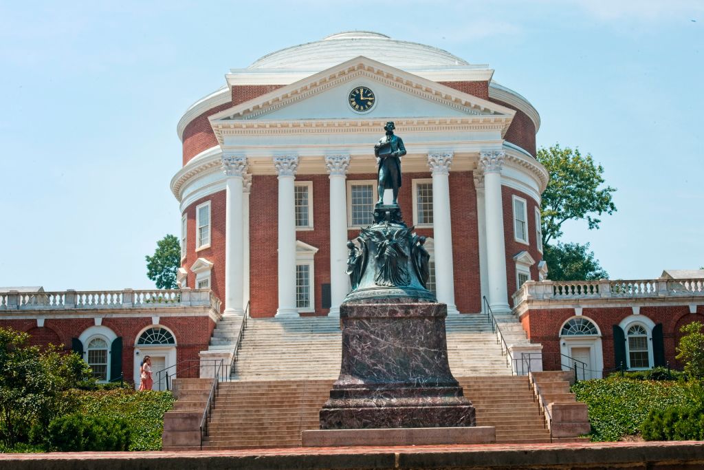 Statue of Thomas Jefferson in front of The Rotunda on the campus of the University of Virginia in Charlottesville, Virginia, as seen in July 2021. (Photo by: Robert Knopes—UCG/Universal Images Group/Getty Images)