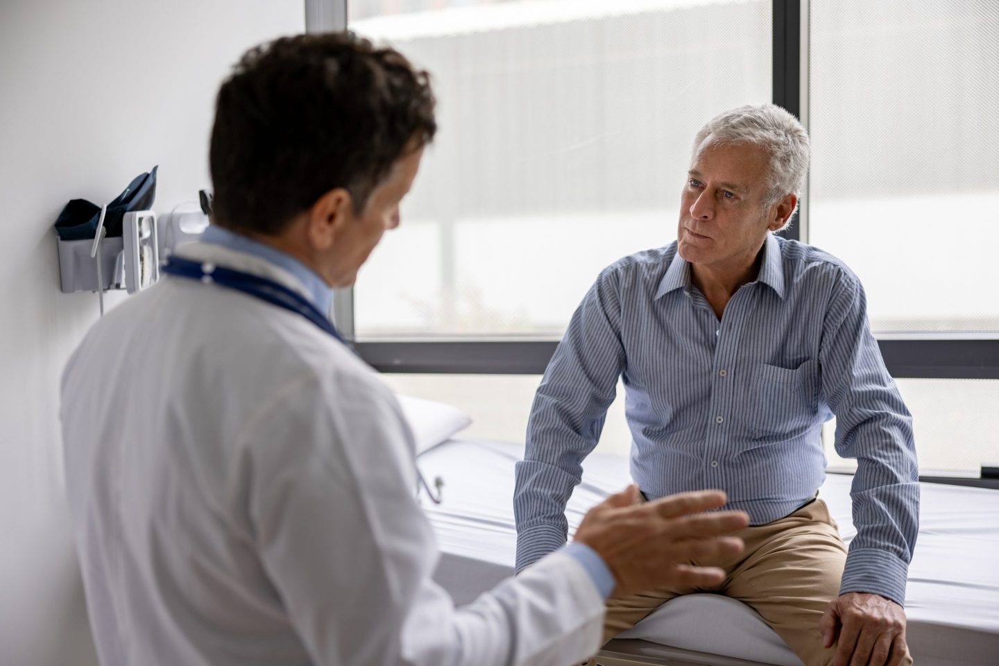 Man speaking with his doctor during an office visit
