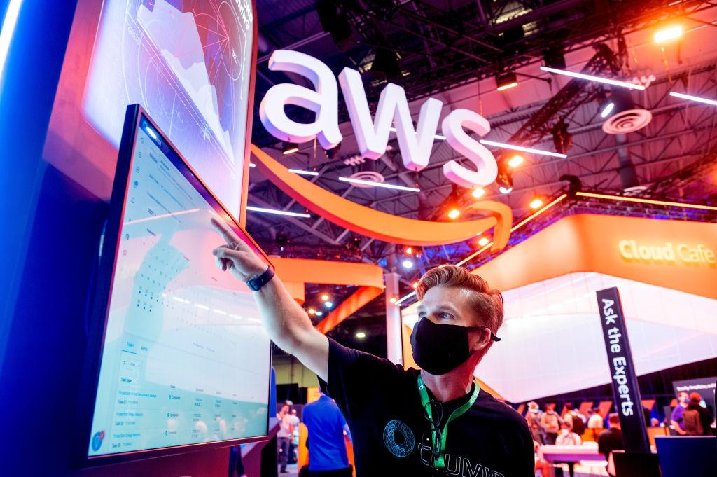 An attendee demonstrates software during AWS re:Invent 2021, a conference hosted by Amazon Web Services, at The Venetian Las Vegas, as seen in November 2021 in Las Vegas, Nevada. (Photo by Noah Berger/Getty Images for Amazon Web Services)