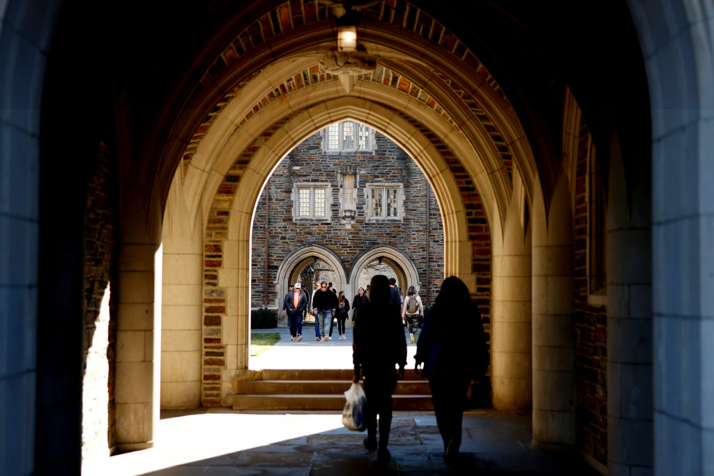 People walk through the campus of Duke University, as seen in February 2022 in Durham, North Carolina. (Photo by Lance King/Getty Images)