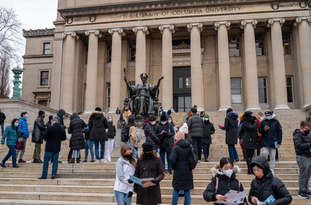 Prospective students wait for a tour to begin, as seen in February 2022 on the campus of Columbia University in New York City. (Photo by Robert Nickelsberg/Getty Images)