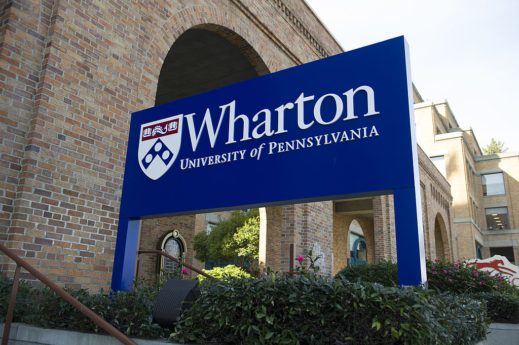 Signage for the University of Pennsylvania's Wharton School stands outside of the campus in San Francisco, California, as seen in February 2012. (Photographer: David Paul Morris—Bloomberg/Getty Images)