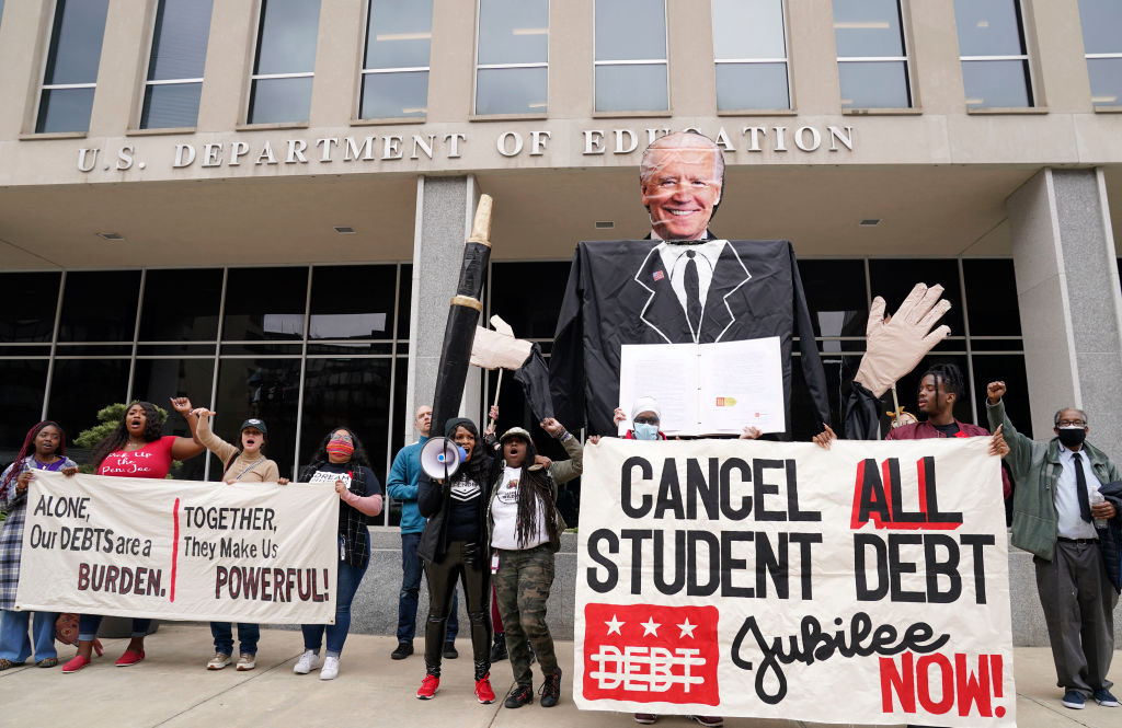 Supporters of The Debt Collective convene at the U.S. Department of Education to demand full student debt cancellation, as seen in April 2022 in Washington, DC. (Photo by Leigh Vogel/Getty Images for MoveOn & Debt Collective)