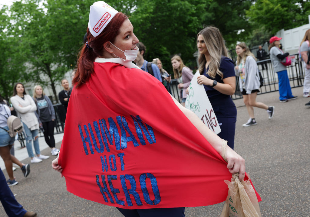 Nurses, medical professionals, and supporters rally to honor the lives and service of those lost and advocate for change in the nursing profession, as seen in May 2022 in Washington, DC. (Photo by Kevin Dietsch/Getty Images)