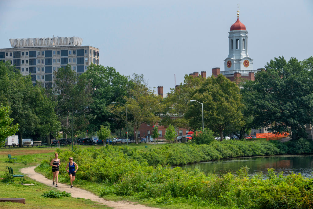 Running in John W. Weeks Bridge and clock tower over Charles River in Harvard University campus, as seen in August 2021 in Cambridge, Massachusetts. (Photo by: Sergi Reboredo—VW Pics/Universal Images Group/Getty Images)