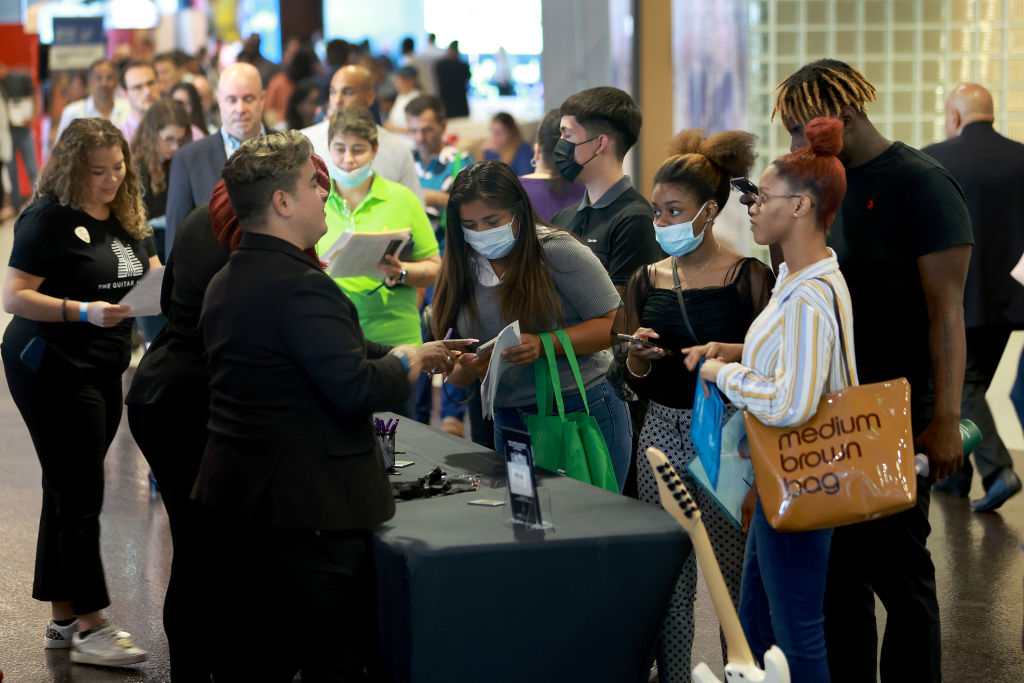 People visit the Hard Rock Hotel and Casino booth setup at the Mega Job Fair held at the FLA Live Arena, as seen in June 2022 in Sunrise, Florida. (Photo by Joe Raedle/Getty Images)
