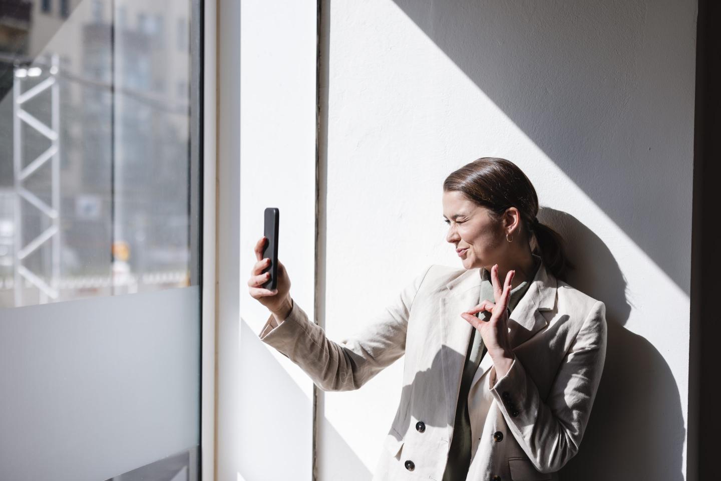 Businesswoman taking selfie